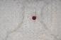 Preview: Hand knitted brooch in white with red pearl